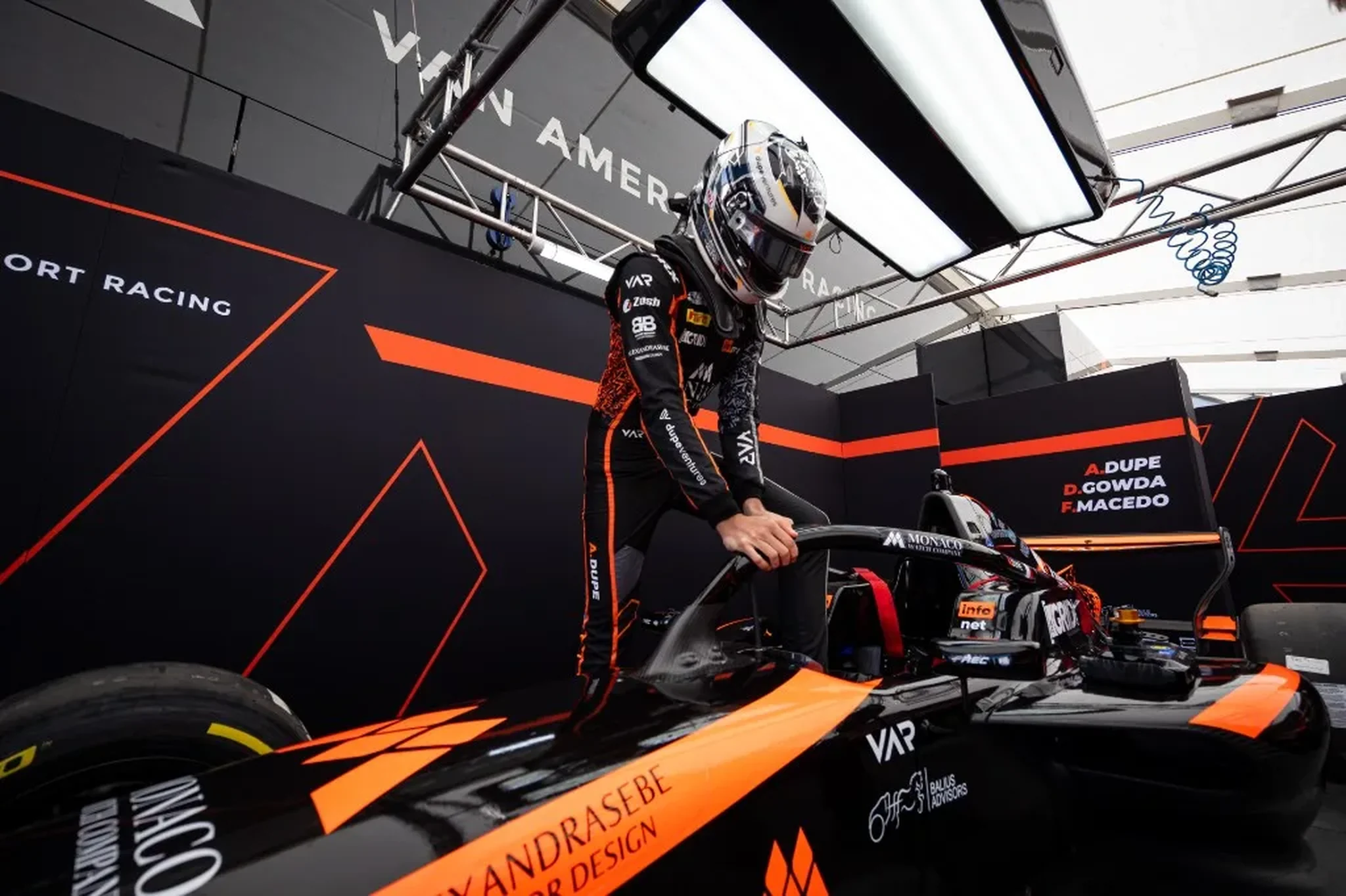 Andrea Dupé with his car in the garage.