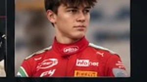 Andrea Dupé in his red racing suit.