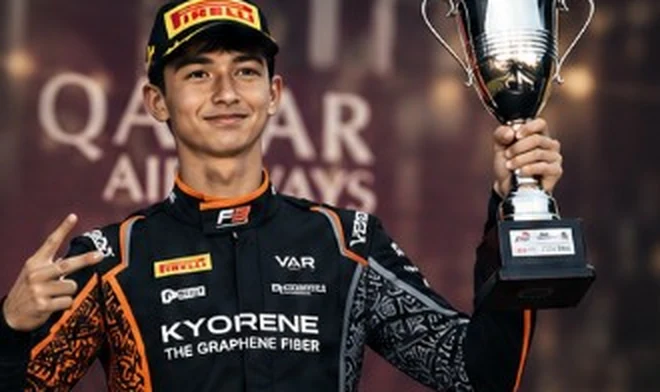 A Parnasse Stratos driver holding a trophy.